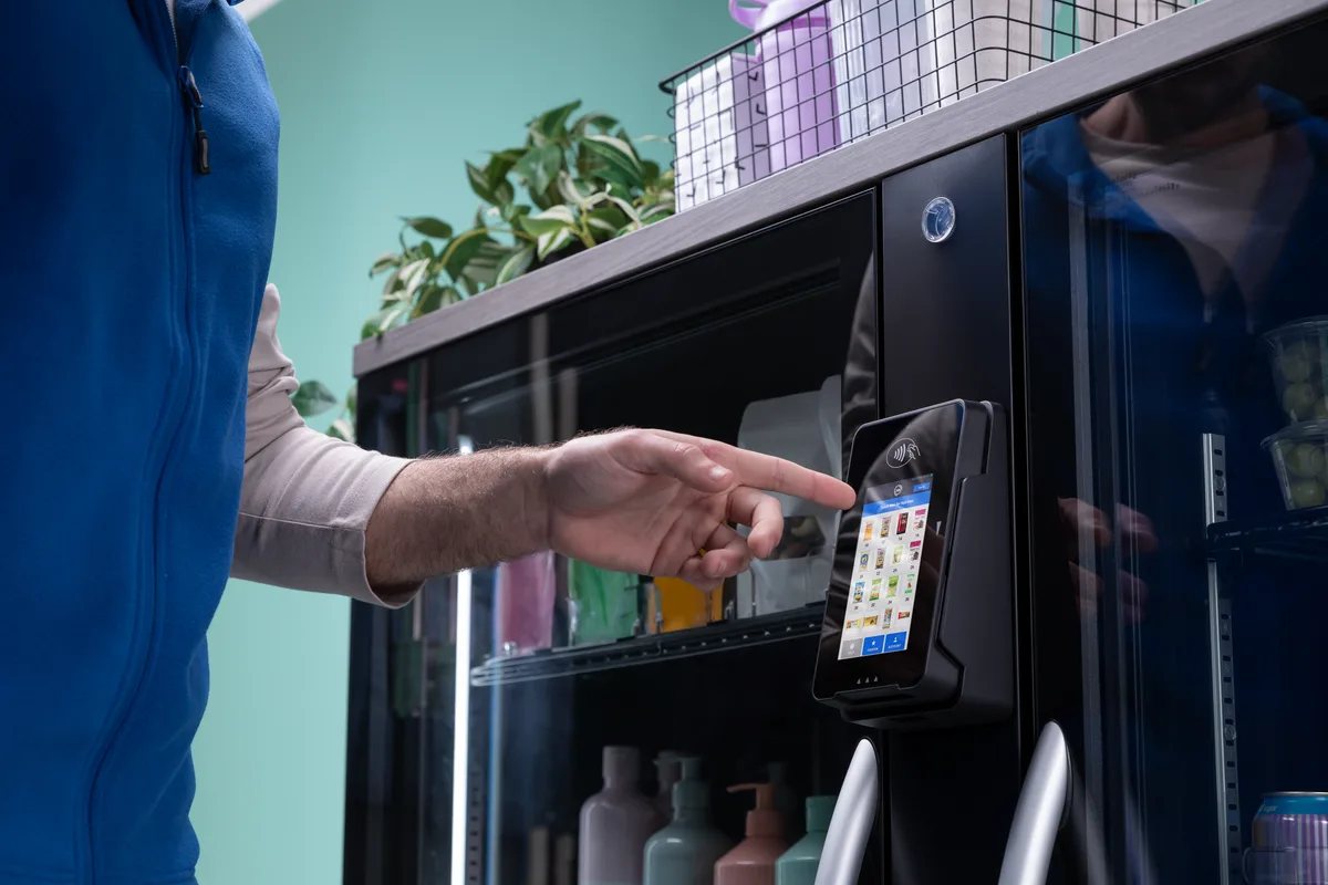 Smart micro market in a modern Triangle, NC workplace lobby — bright, spacious environment with self-serve food and beverage access